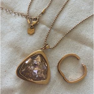 Touchstone long rose gold necklace with pink stone and necklace shortener.